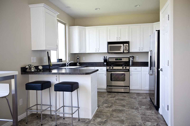Black Granite With White Kitchen Cabinets