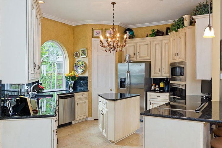 White kitchen with black pearl granite countertops