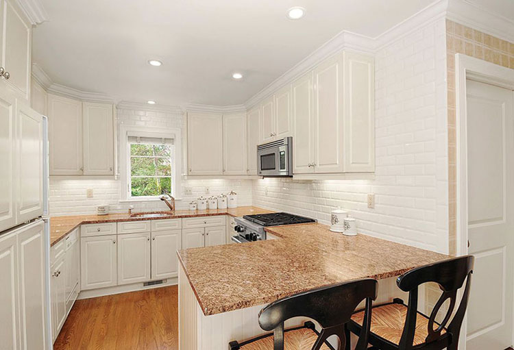new venetian gold granite countertops with white cabinets