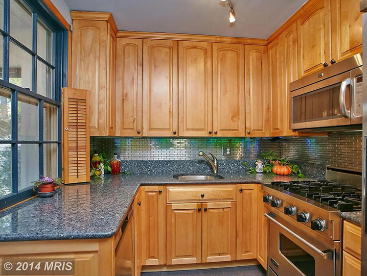 Honey oak cabinets with blue pearl granite