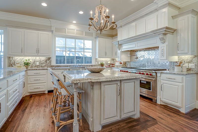 Traditional Kitchen With White Cabinets And Aspen White Granite Countertops