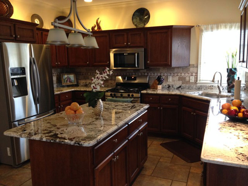 Kitchen With Brown Cabinets Delicatus White Granite Countertops