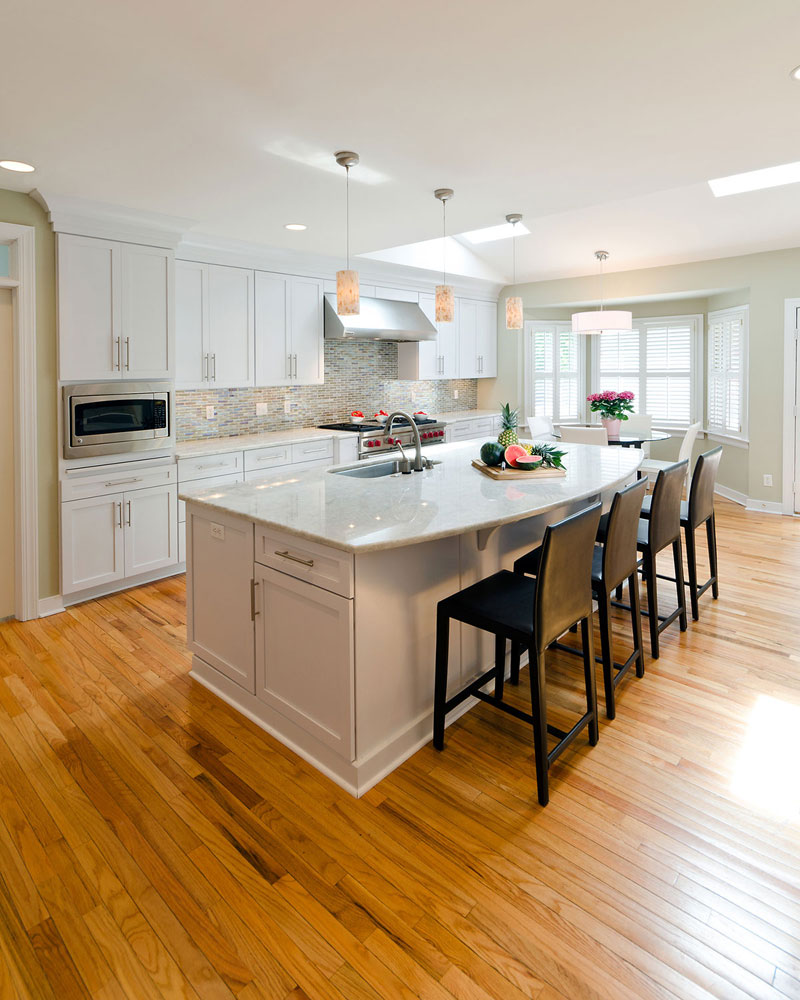 Kitchen With White Cabinets And White Pearl Granite Countertops