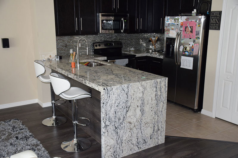 White Ice Granite With Black Cabinets